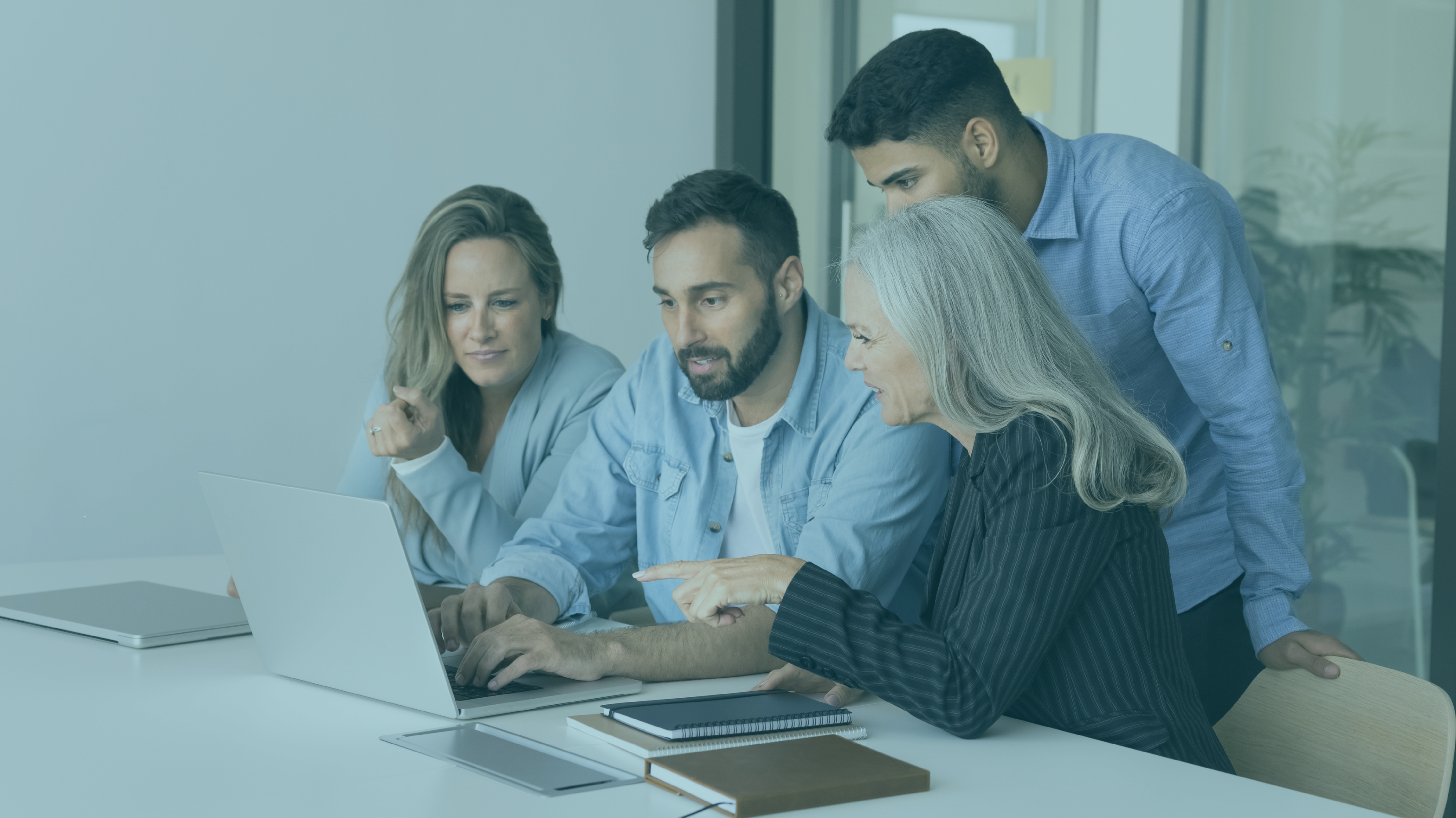 Co-Workers Collaborating at Computer