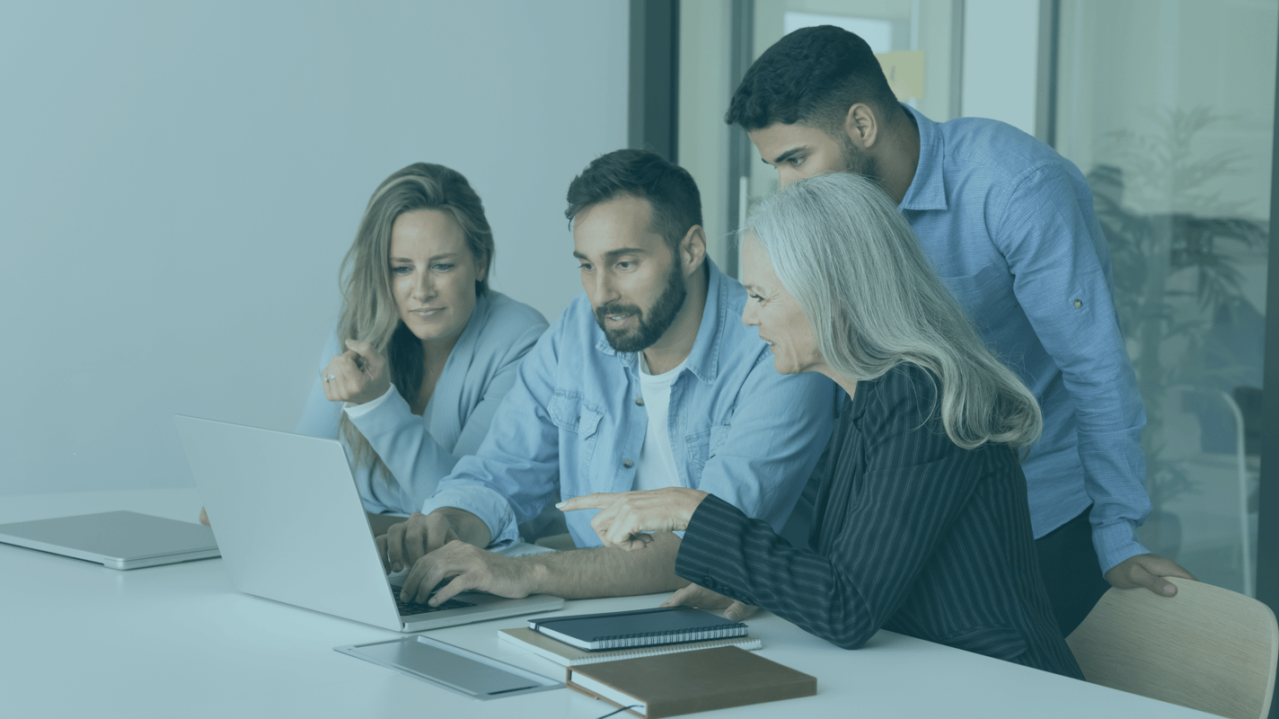 Co-Workers Collaborating at Computer